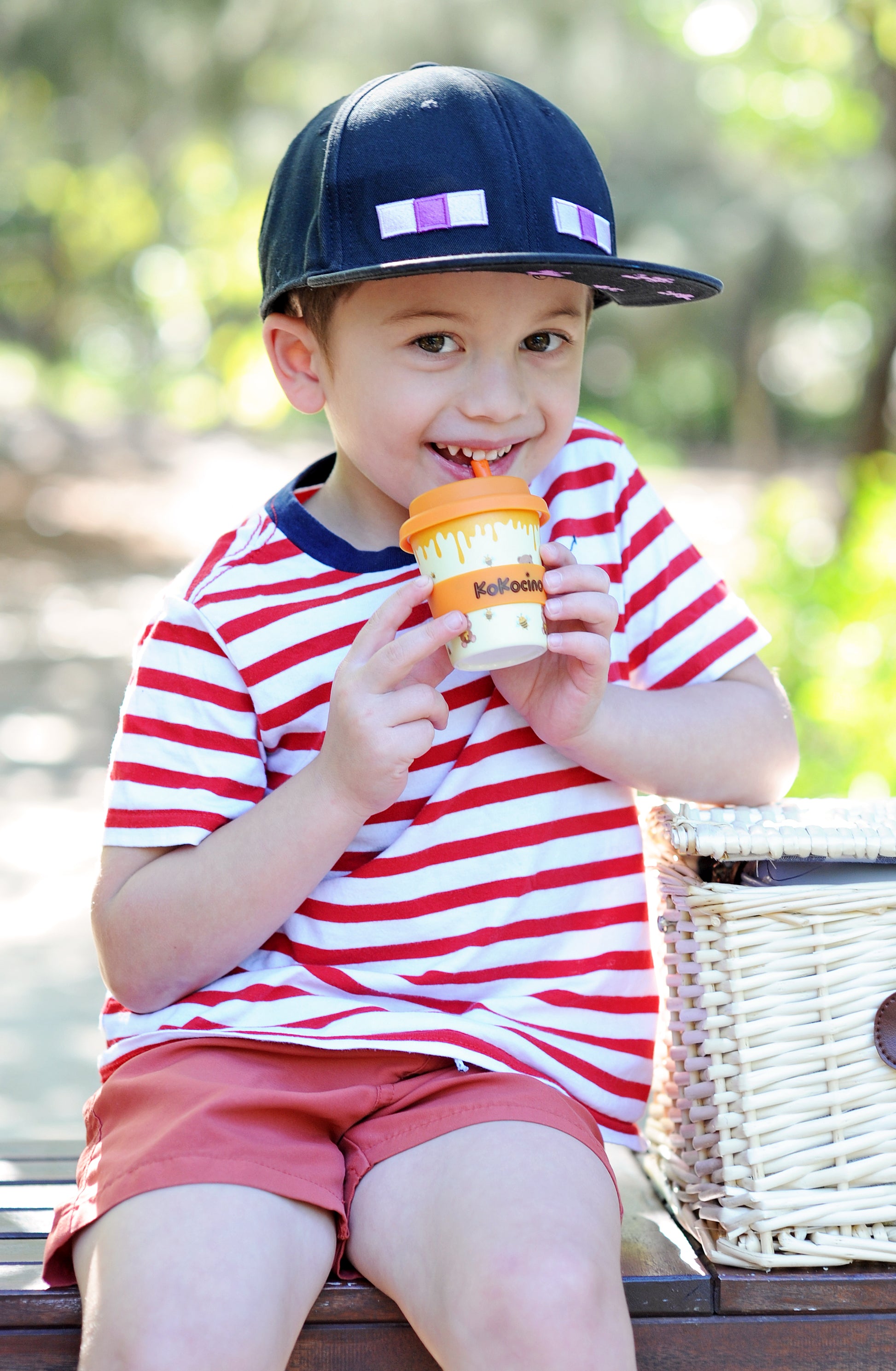 Cute boy loves his babyccino cup